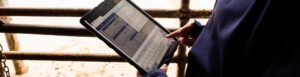 Hands holding tablet showing MyCHS app screen
