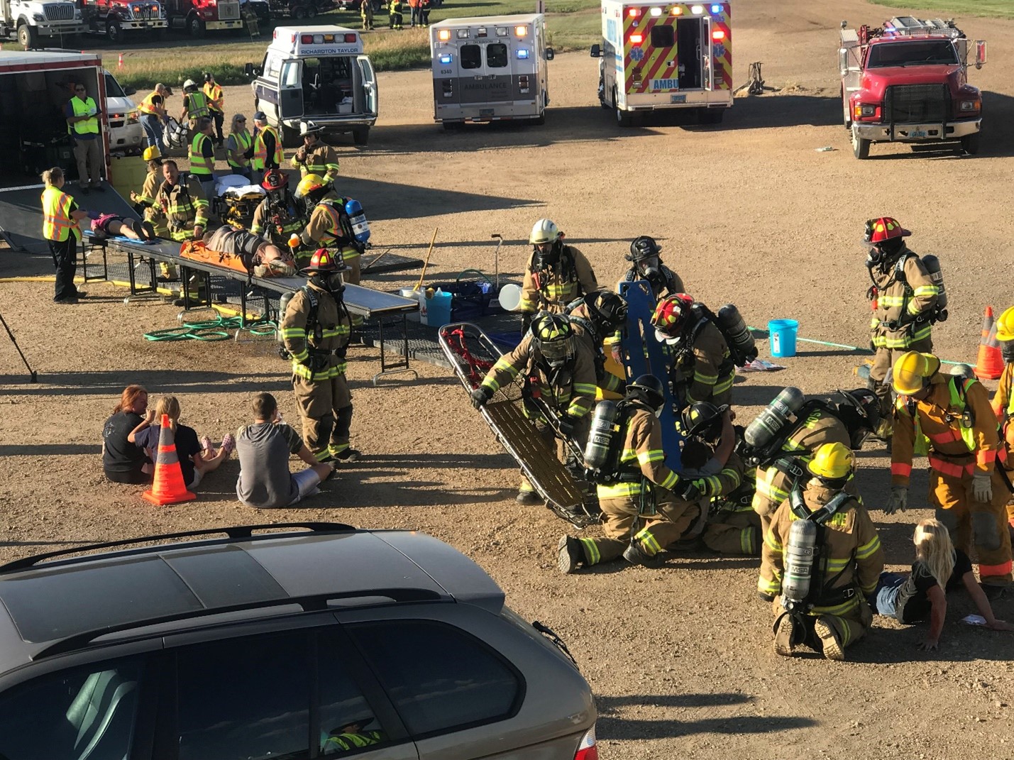 Firefighters performing an emergency response drill at a high school
