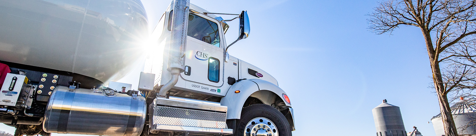 Propane truck delivering at farm